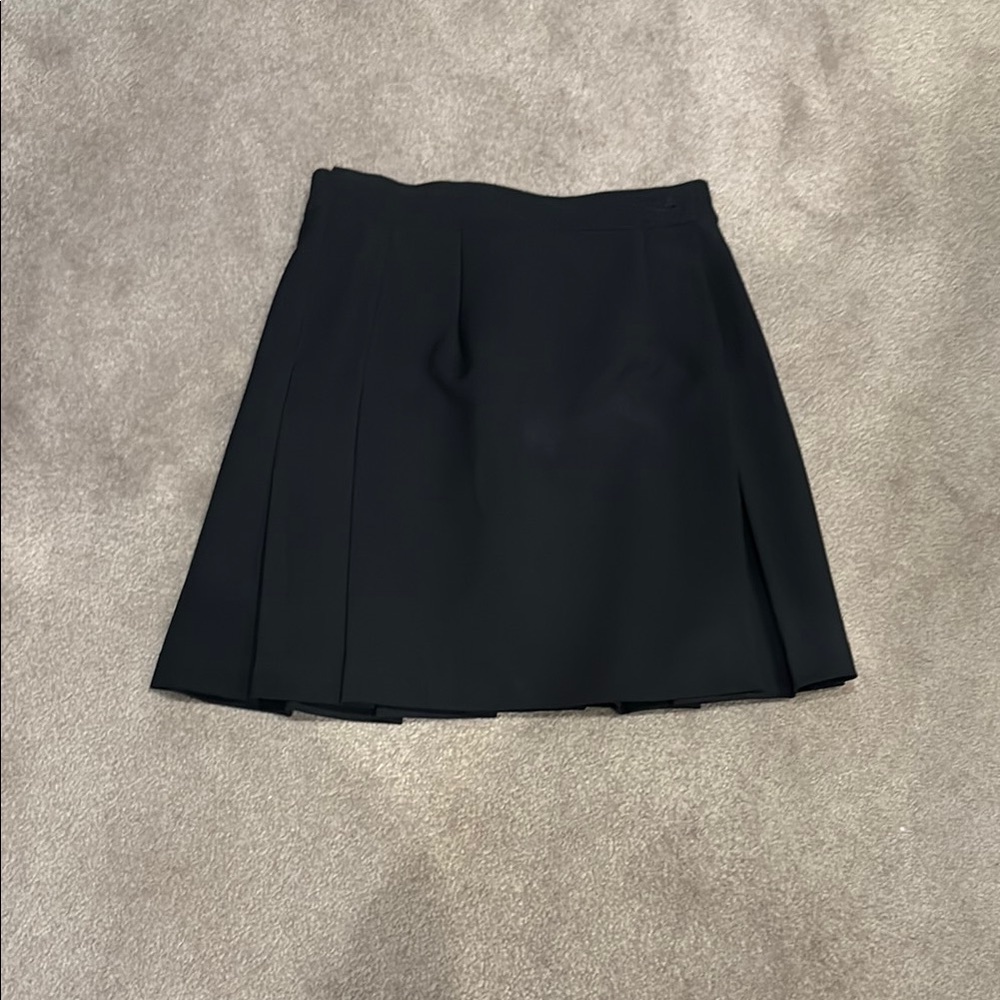 Size 5/6 black tennis skirt. Wrap around adjustable 2 button